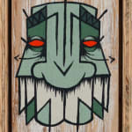 GATS character in green and white painted on a white wooden background