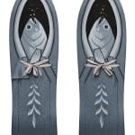 Set of two skate decks painted in a grayscale depicting a set of fish nestled in a carrier, complete with tied laces and other detailing throughout by artist Jeremy Fish
