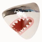 sculpture of a shark head with its teeth showing