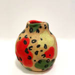 Jackie Brown's vase with cheetah print with green yellow and green shapes