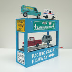 side-view of diorama-like sculpture featuring various vehicles and CA road signs by We Are Out of Office