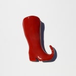 ceramic sculpture of red pointy cowboy boot