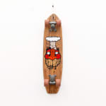 Brown wooden vintage skateboard with a red face GATS character with an atomic bomb smoke ring coming out of the top of his head painted on the bottom of the board