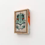 GATS character in green and white painted on a white wooden background