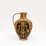 GATS character painted on a metal brown vase in black