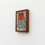 GATS character with long white tentacles and a red and orange beard on a wooden background