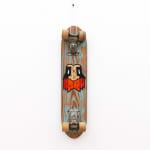 Wooden vintage skateboard with GATS character with an orange beard painted on it
