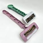 Annie Duncan - ceramic sculpture of a pair of razors in pink and mint green.