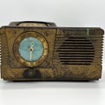 front of antique radio decorated by GATS