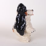 Katie Kimmel - ceramic sculpture of a black and white basset hound standing on its hind legs