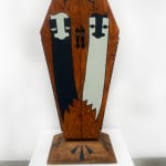 Wooden coffin with two ghost painted on the front doors and GATS written on the side