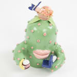 Jen Dwyer sculpture of green cactus with pink lips holding laptop, banana and Nutella jar
