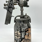 metal spray paint can decorated with GATS symbols