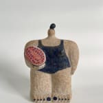 Ceramic sculpture of a figure wearing a navy bathing suit and holding a watermelon