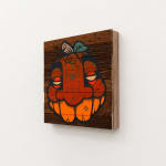 GATS character painted like a pumpkin on a wooden background
