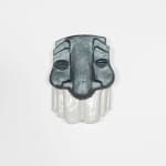 sculptural mask with a metallic grey top and white bottom