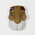 sculptural mask with a light brown textured top and a white bottom