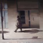 Kim Cogan painting of figure walking down city street, muted pastel tones