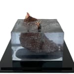 sculpture of a woman on a rock and another woman being eaten by a shark in the water