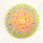 Circular sculpture by Dan Lam with multicolor circles and tiny bright yellow spikes.