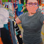 Painting of a woman wearing a mask and glasses next to a rack of clothing by Marianna Olague.