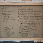 Photo of the back of the canvas with a handwritten recipe for "A Simple But Perfect Sauce" by the artist