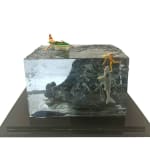 sculpture of a person rowing a boat and another person swimming with a shark coming to eat them