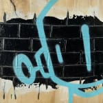 light blue robot outline against a black brick wall