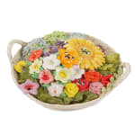 Katie Kimmel's ceramic sculpture of a basket with flowers