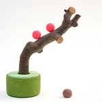 CHIAOZZA - sculpture of pigmented paper pulp green base and pink sphere with apple tree branch