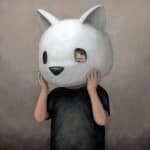 a human holding a bear head helmet over his own head