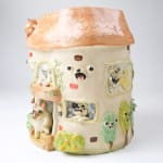 Katie Kimmel ceramic vase made to look like a house with dogs surrounding it