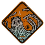 Orange road sign with detailed illustration of a masculine face, long beard, and intricate symbols/patterns in around the face.