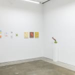 Install image of "Cosmic Bloom." From left to right, CHIAOZZA's collages, "Six Green Dots in Pale Peach," "Fluorescent Red Mound in Ash Rose," "Two Cool Spheres in Mustard," "Apple Elbow in Olive & Luminous Red," "Bouquet Painting No. 47."