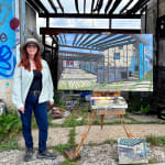 Painting by Valeri Larko of an abandoned room with atists next to it