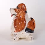 Katie Kimmel - ceramic sculpture of a brown and white basset hound, its body is rounded like a balloon