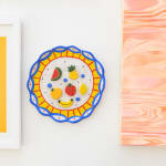 Jackie Brown's sculpture with of a plate with fruit hanging at the gallery