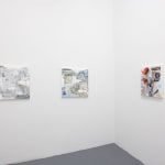 corner of gallery room with white walls and two paintings on the left wall, one painting on the right wall
