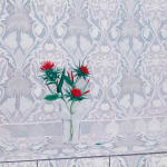 Painting of red flowers in a clear vase on a surface that blends into the walls in the back. The walls and flat surface are covered in a white and gray design.
