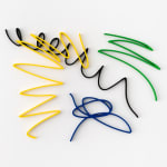 Multi color scribble artwork from Arnaud Vidricaire made of laser cut wood in yellow black green and blue