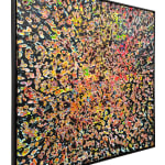 Alternate side view of Jason Hallman excavated painting with black background and multi colored excavation spots with red blue green and yellow