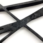 Close up of Black scribble abstract artwork resembling a math equation by Arnaud Vidricaire made of burnt laser cut wood in the form of a diptych