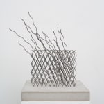 Wire sculpture on cement base