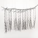 Bundles of wire rope hanging from wire net