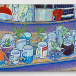 Tabletop piled with ceramic cups and mugs