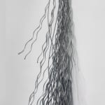 Side view of wire rope bundles hanging on a wall