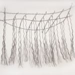 Bundles of wire rope hanging from wire net