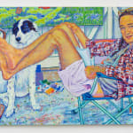 Man with braids lounging on chair with black and white dog