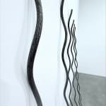 Close up of 6 galvanized rods in a line