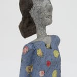 A female bust made from strips of colored tin